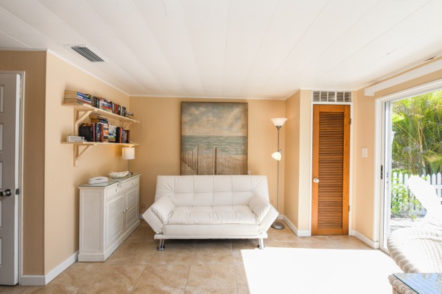 This sitting room located right off the kitchen 
is a great place to curl up with a good book.