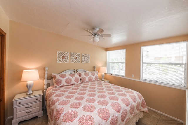 The primary bedroom has a king bed and two closets.