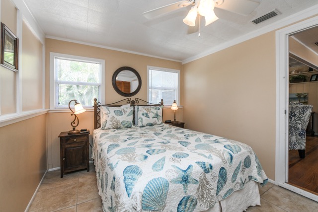 The second bedroom has a queen bed, TV and two closets.