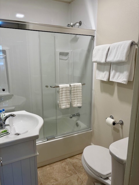 The guest bathroom has a combo bathtub/shower.